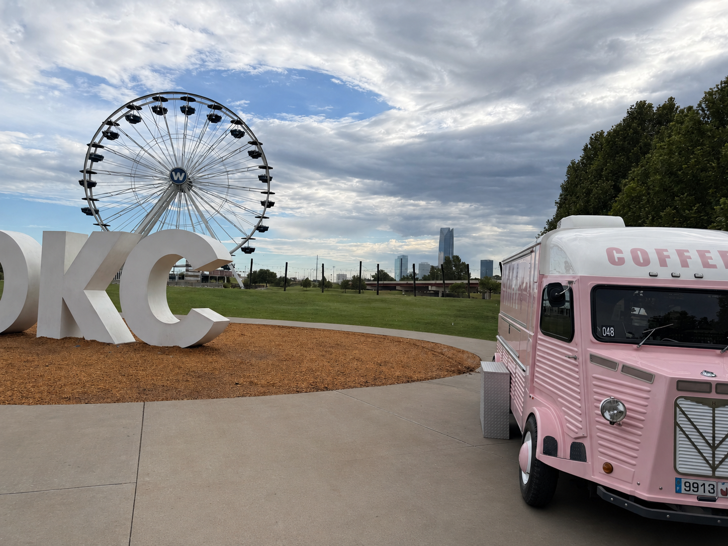 Maple and Honey trailer with downtown Oklahoma City and Ferris wheel in the background